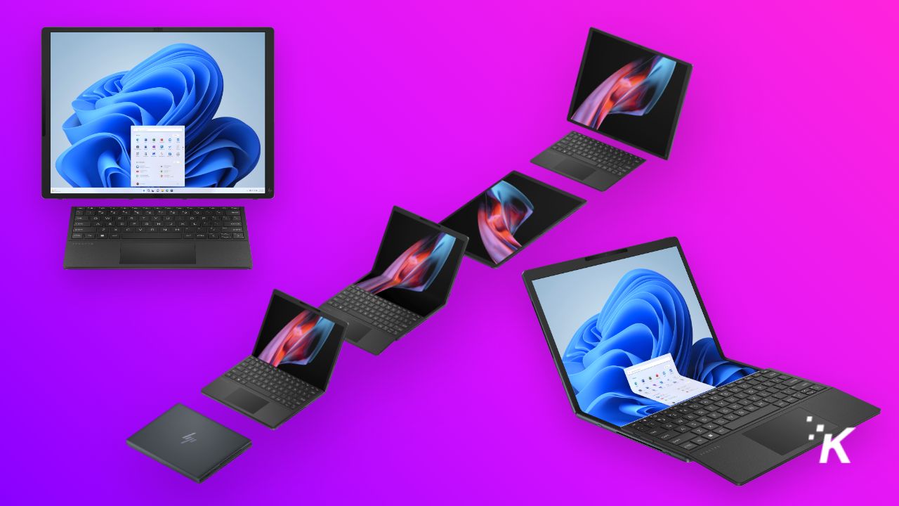 Laptop lipat laptop Hp spectre dengan latar belakang ungu