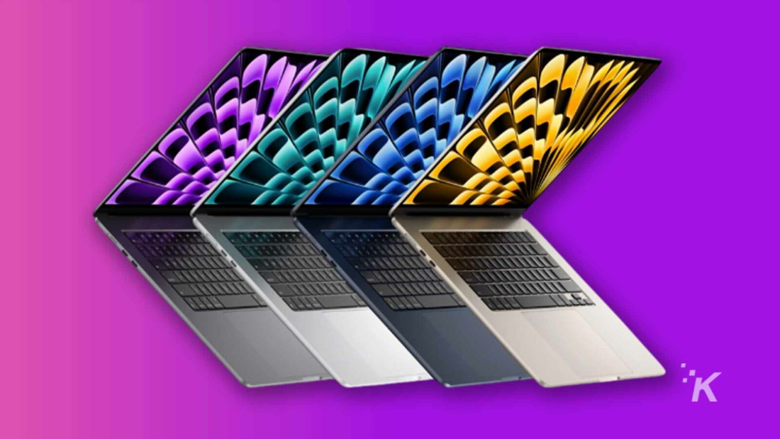 Macbook dengan latar belakang ungu