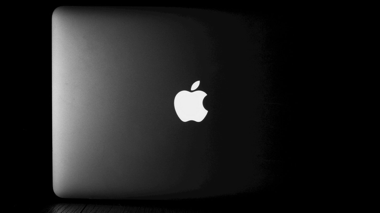 Apple laptop with logo.