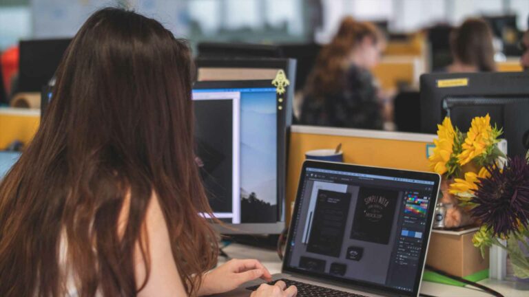 Person on the computer creating a logo.