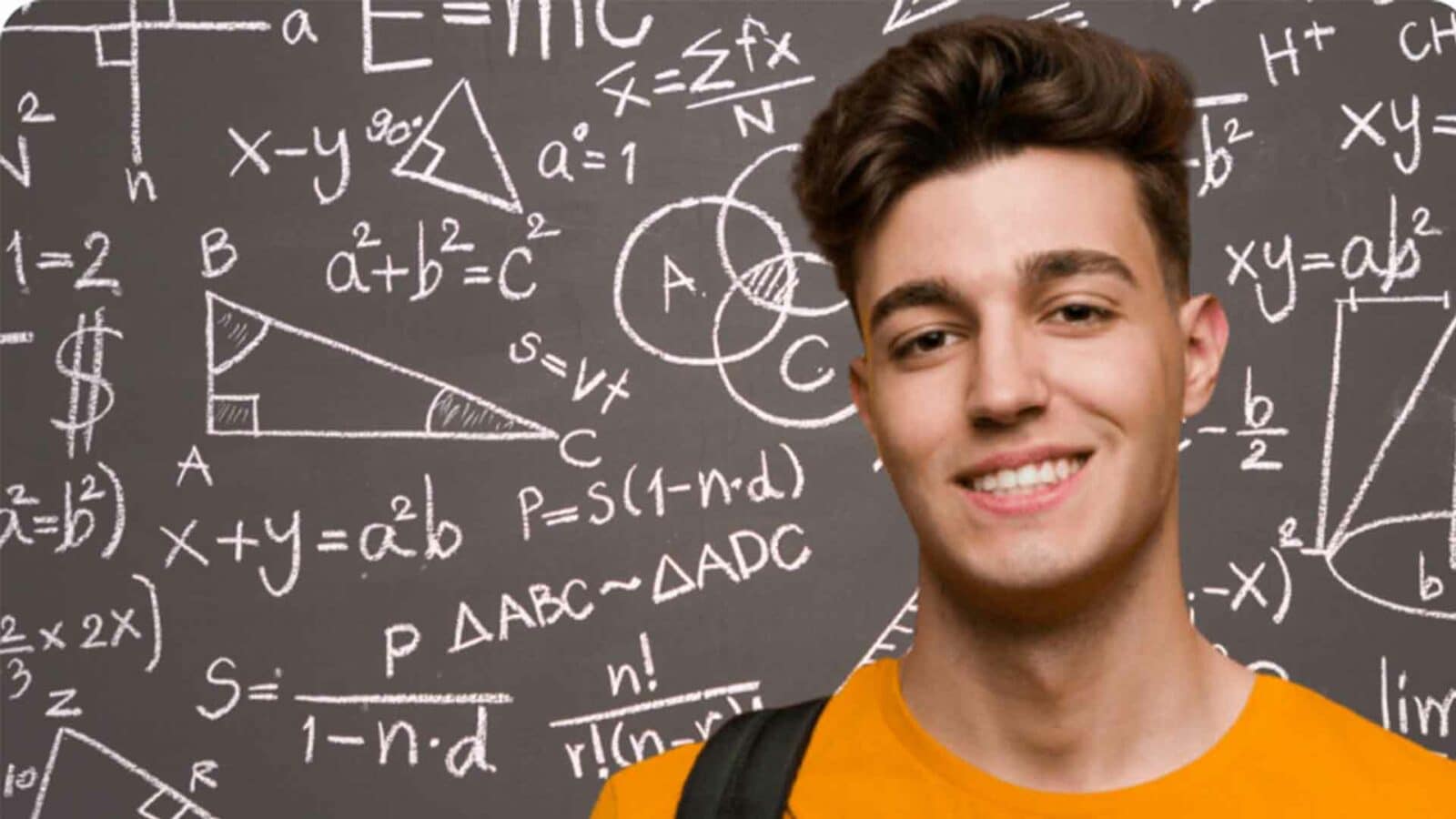 Teen with math problems on chalkboard behind him