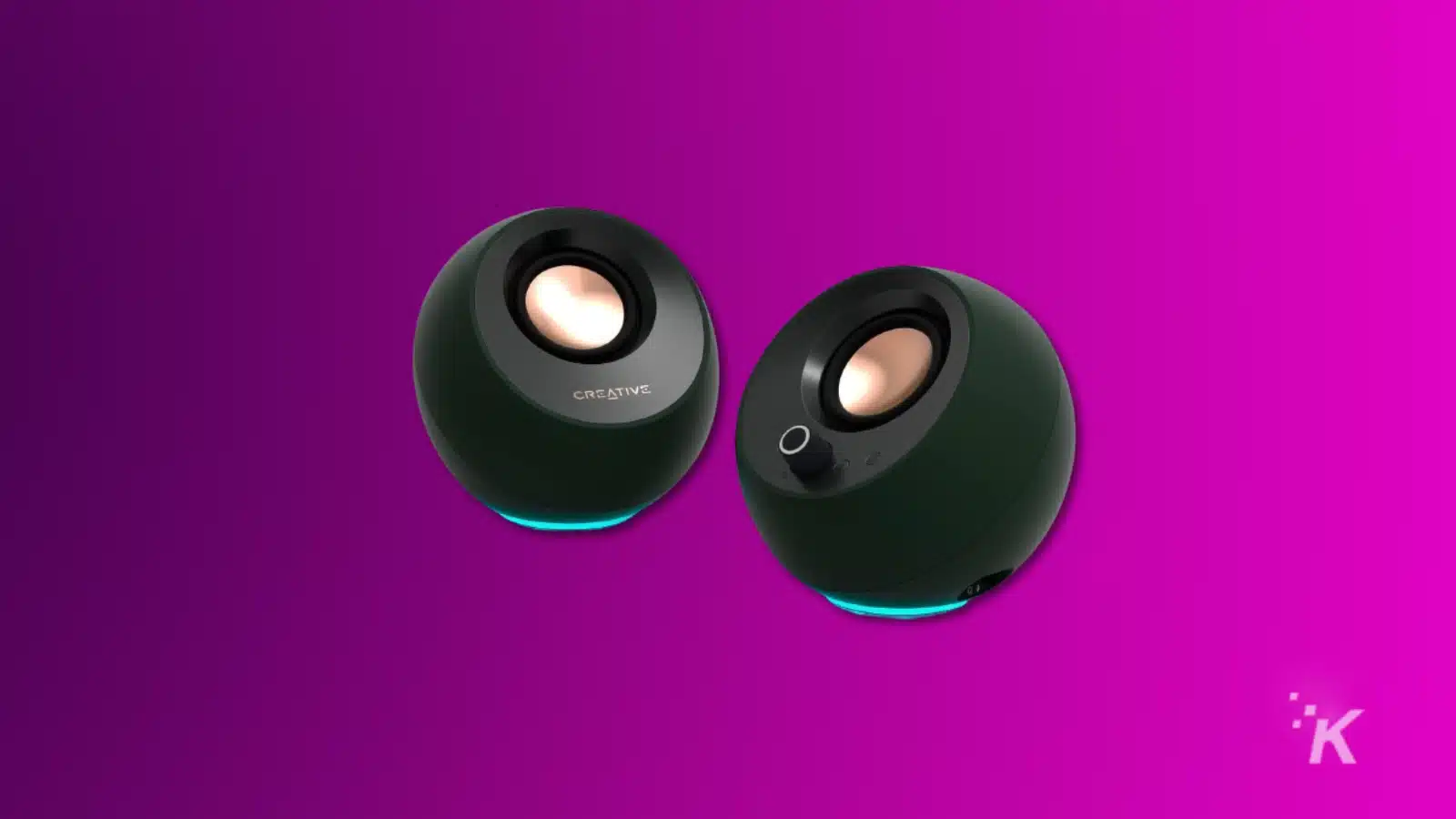 i migliori altoparlanti da gioco (2024) Render of creative pebble pro computer speakers on a purple background