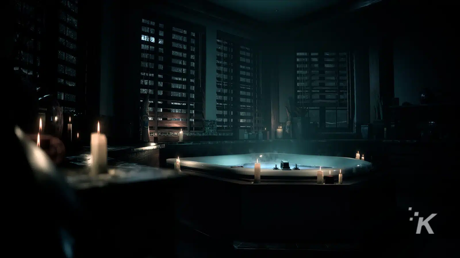 Bak mandi dengan penerangan lilin dalam suasana kamar mandi yang gelap dan mewah.