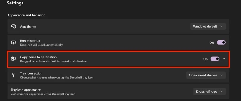 enabling the copy items to destination option in dropshelf settings.